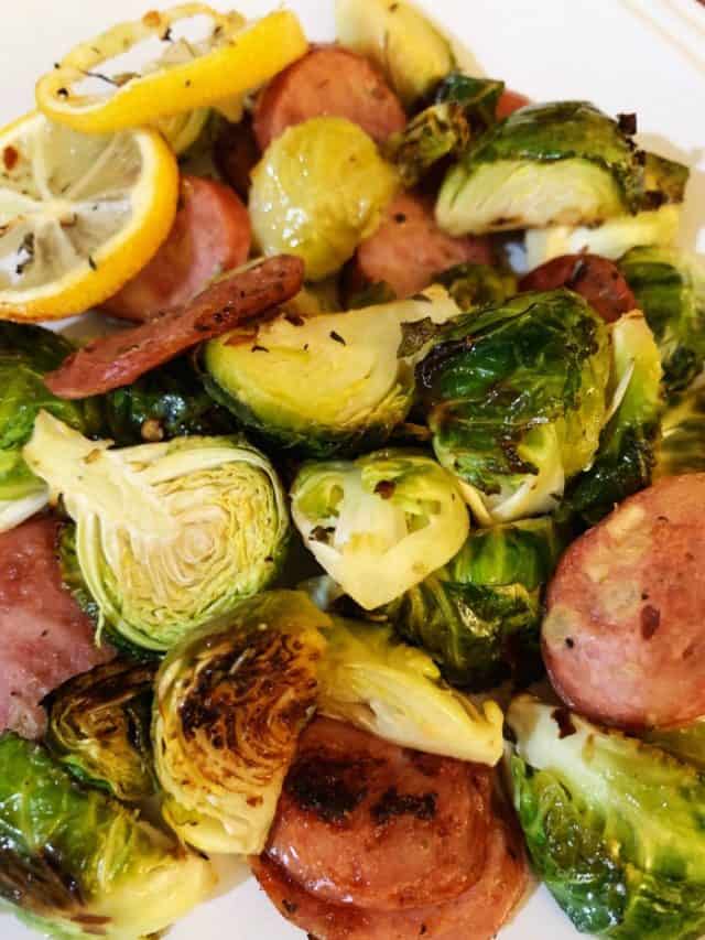 plate of sausage and brussels sprouts sheet pan