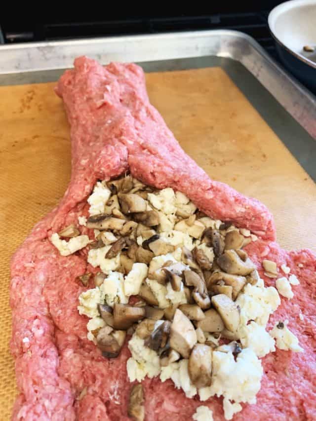 rolling the stuffed meatloaf