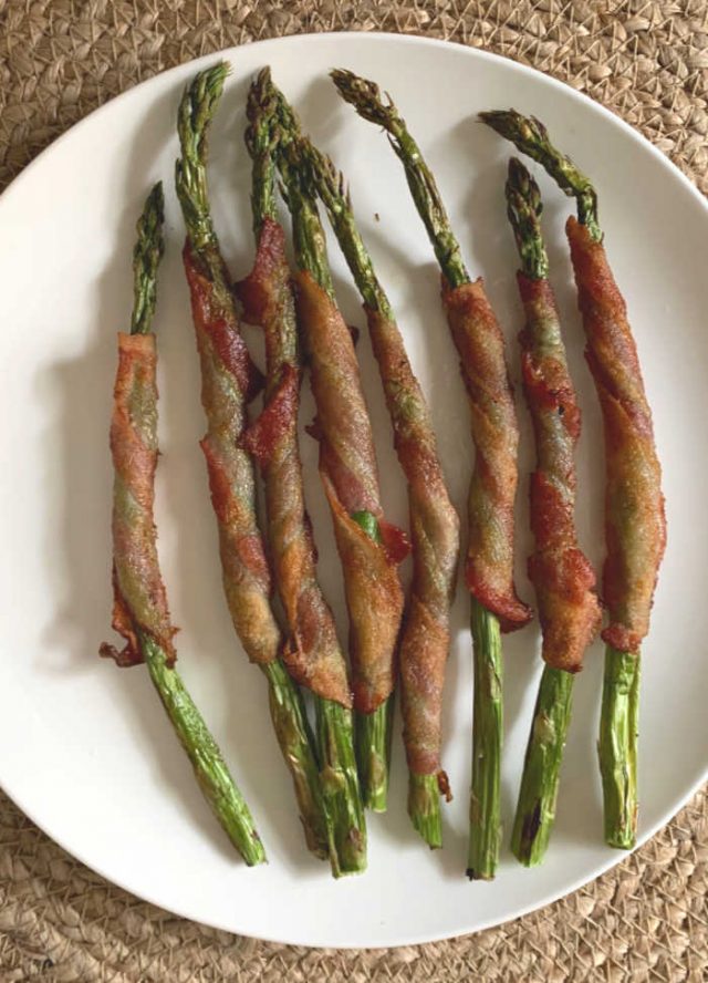 bacon wrapped asparagus on serving dish